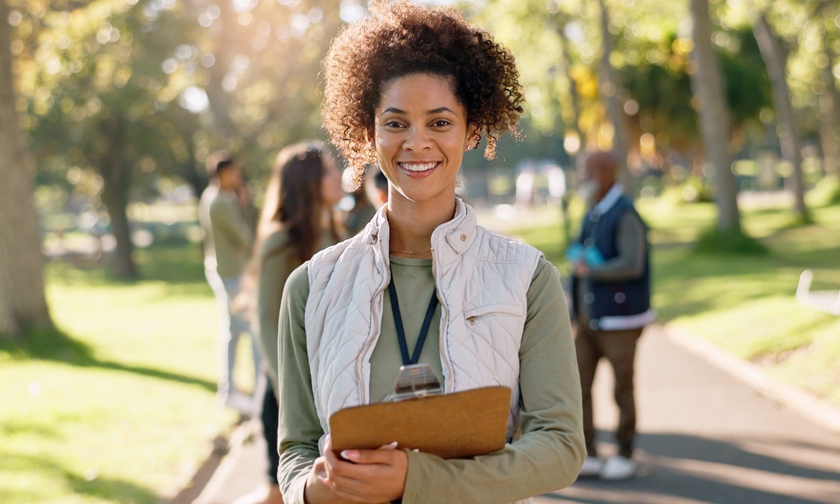 happy-woman-portrait-volunteer-with-clipboard-change-eco-friendly-environment-help-nature-young-female-person-with-smile-ngo-go-green-community-service-survey-outdoor-park-1200x800