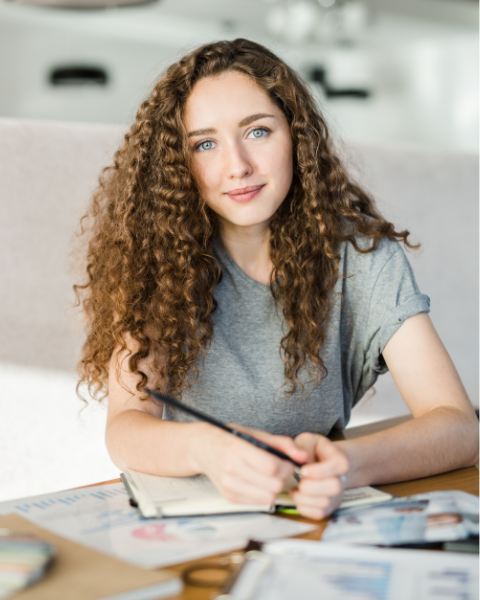 Female student completing dual enrollment college courses while in high school