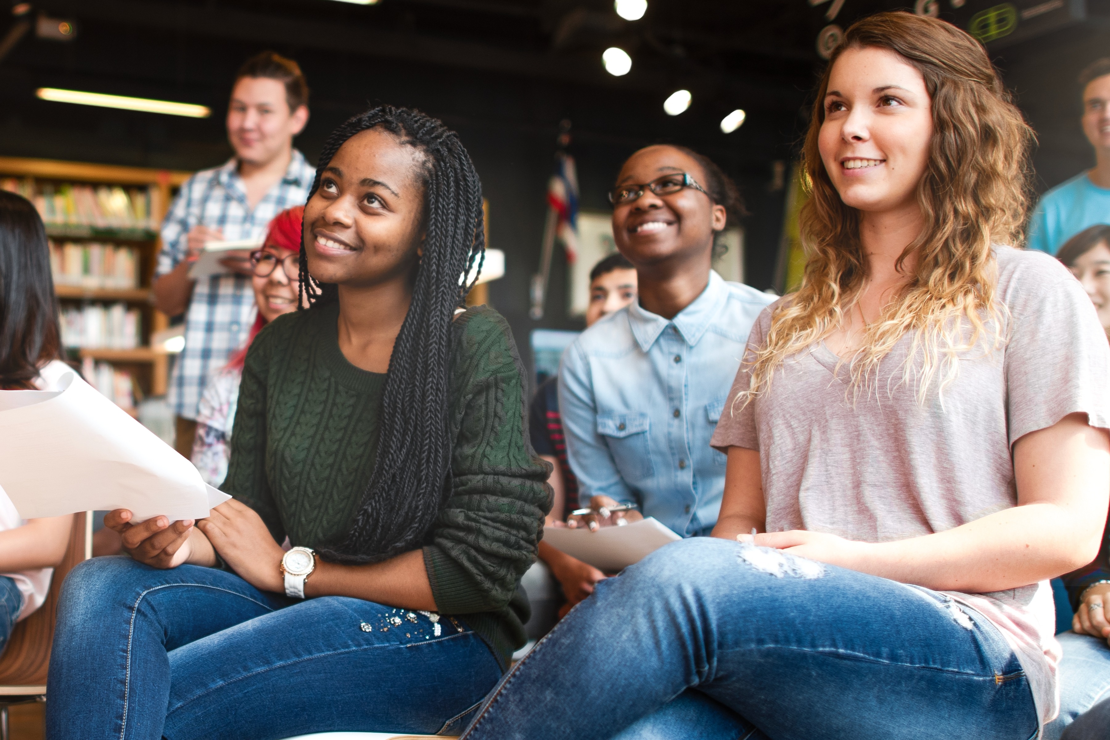 diverse-group-students-classroom-smiling-attentive-young-adults-engaged-learning-classroom-setting-with-diverse-students-international-high-school-students-seminar