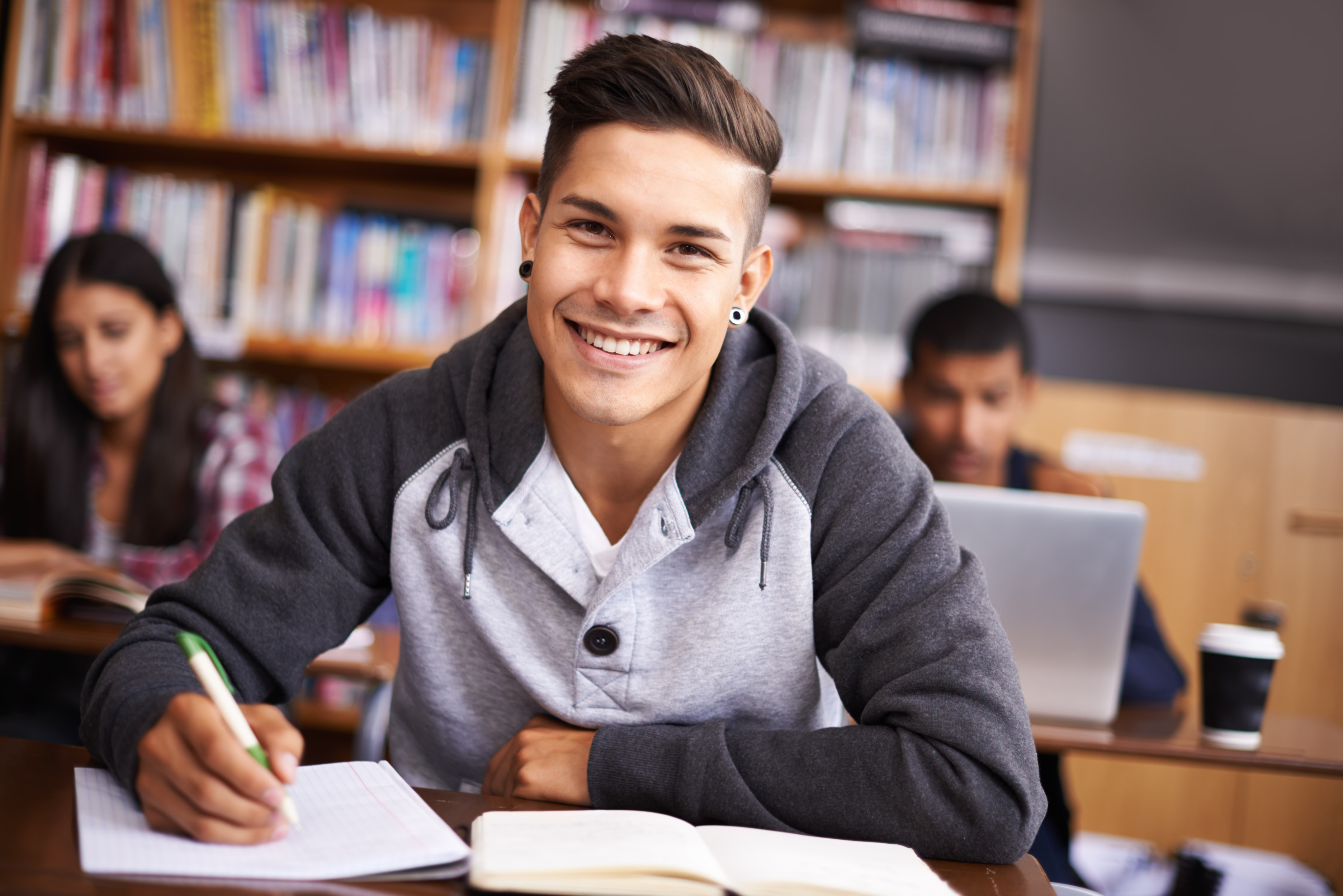 education-writing-happy-with-portrait-man-library-study-research-classroom-quiz-focus-learning-notebook-with-male-student-university-knowledge-scholarship-project