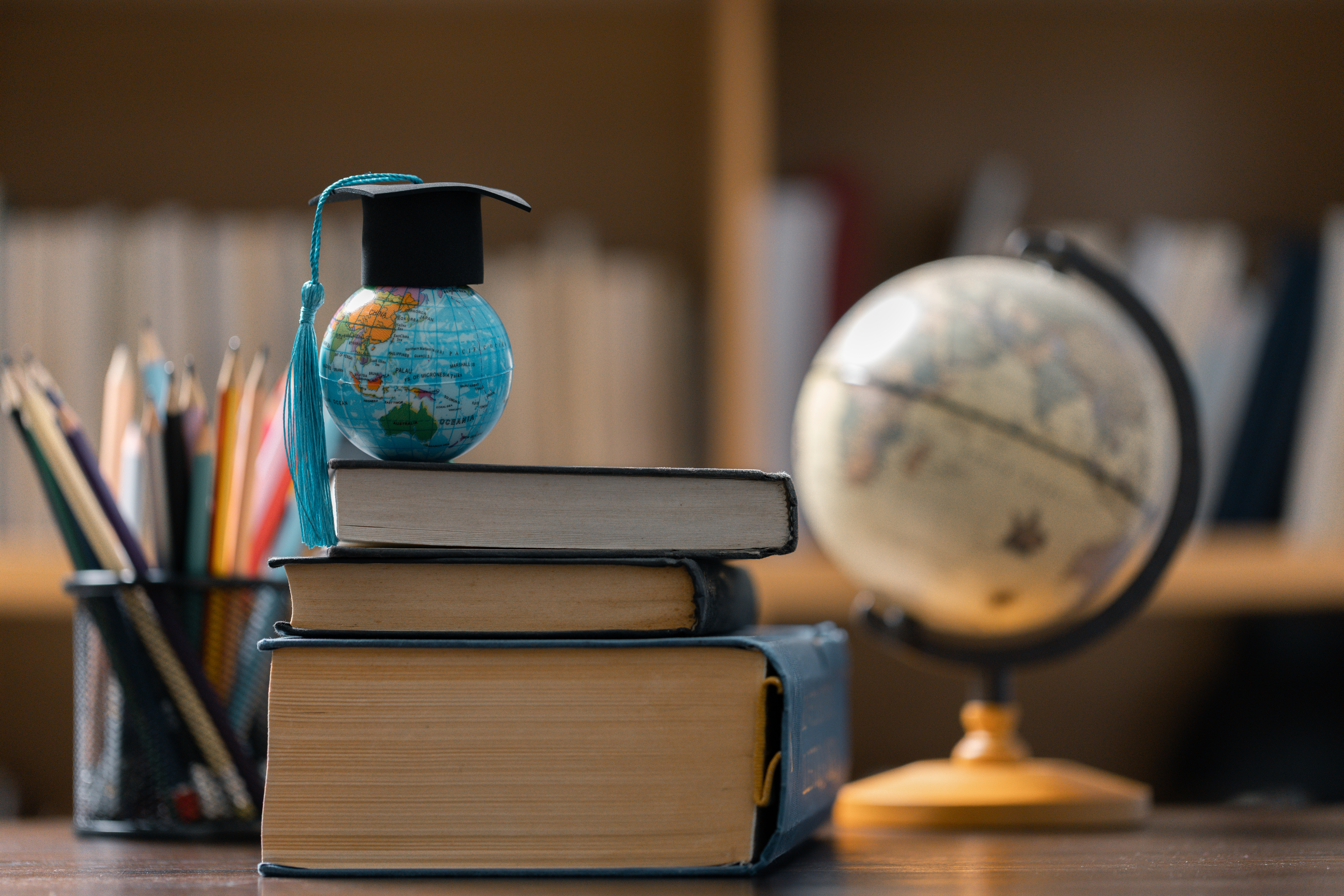 Books and globe on a table
